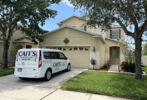 CAIT'S Estate Sale van parked in driveway